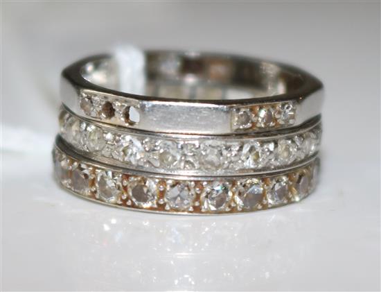 3 platinum and diamond eternity rings (one with stones missing)
